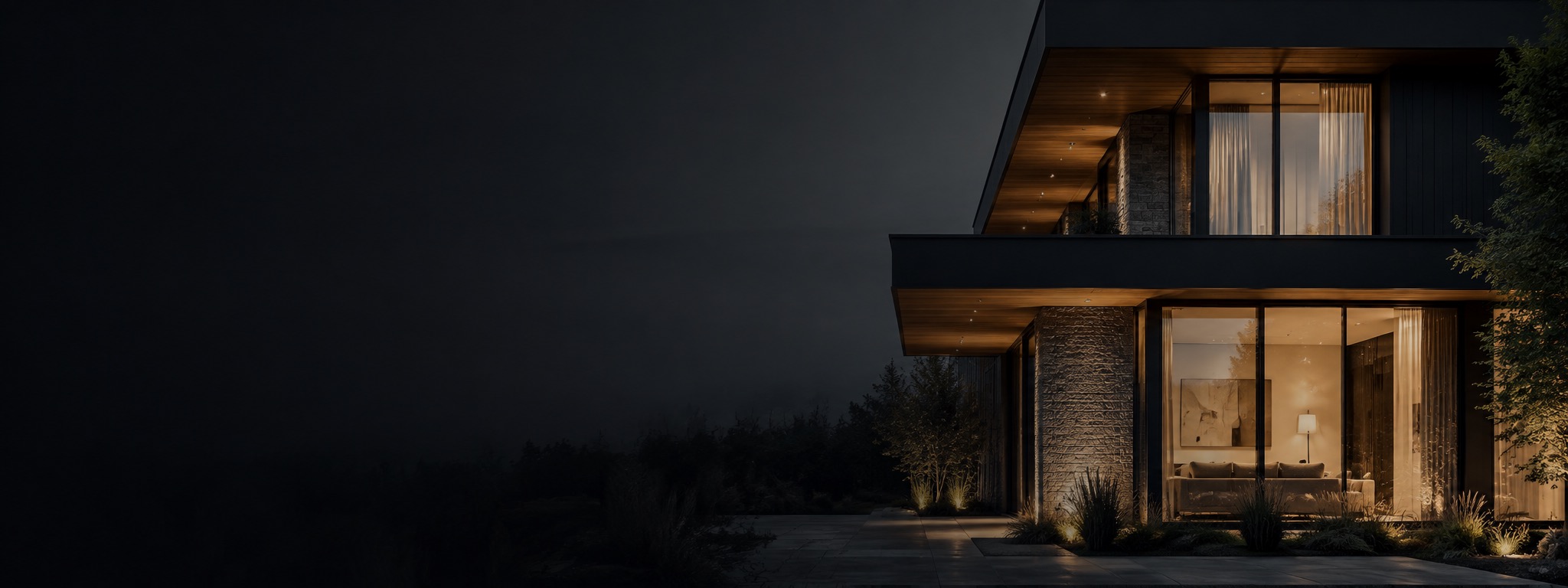 Exterior of a modern house at dusk with warm interior lighting visible through large — Vireo Homes journal