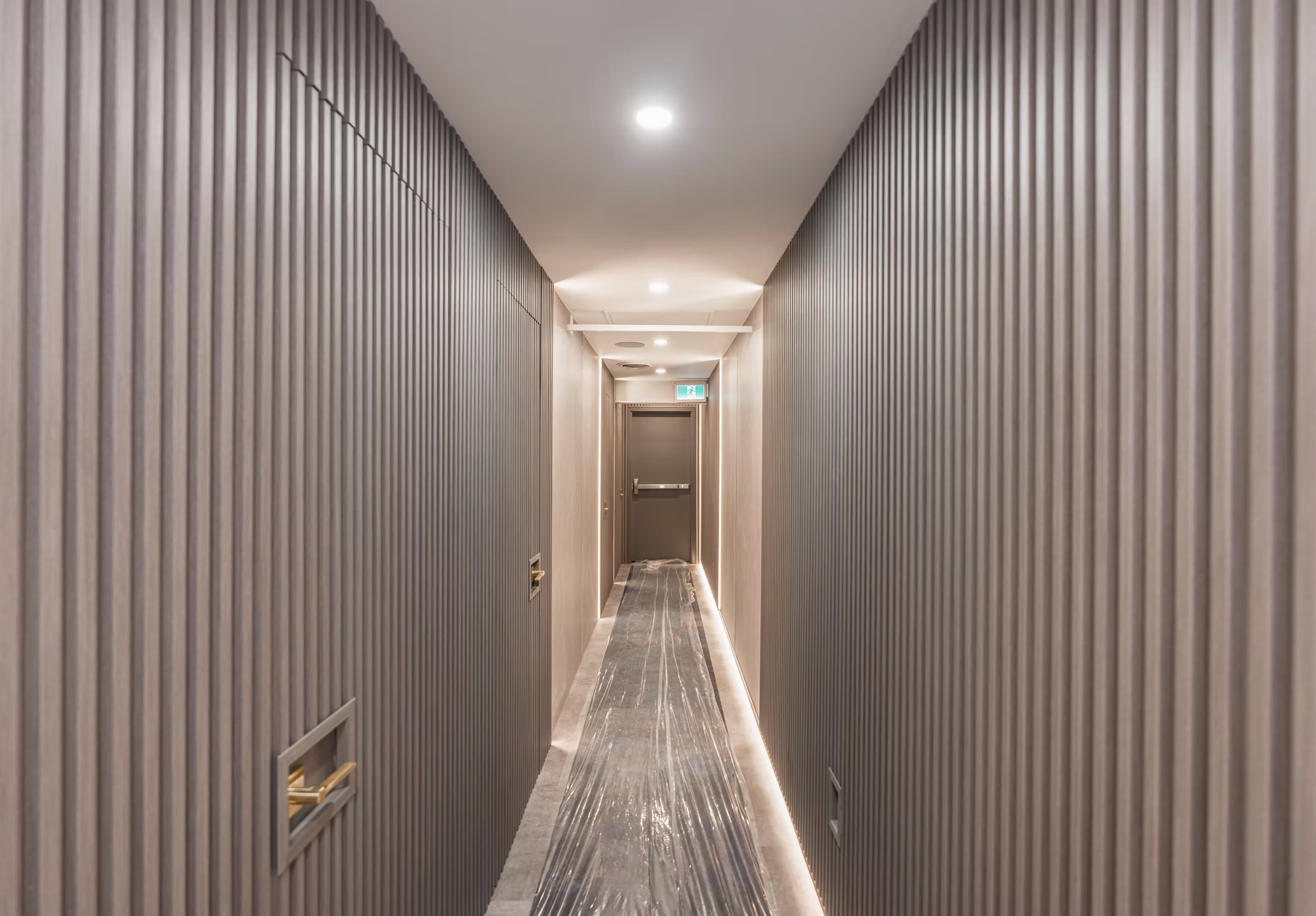 Long modern hallway with dark grey vertical slatted — European window and door project, Vireo Homes GTA