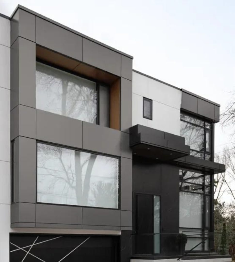 Modern house exterior with dark grey and white panels, large windows, — Vireo Homes exterior cladding systems